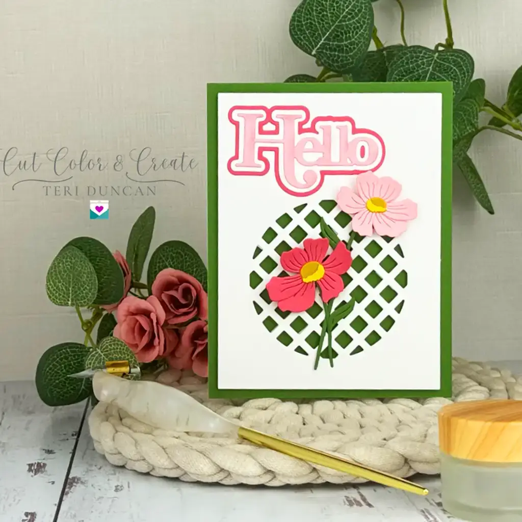 Handmade greeting card decorated with pastel florals and a layered Hello using the new Spotlight Frames and Florals Collection from Spellbinders.